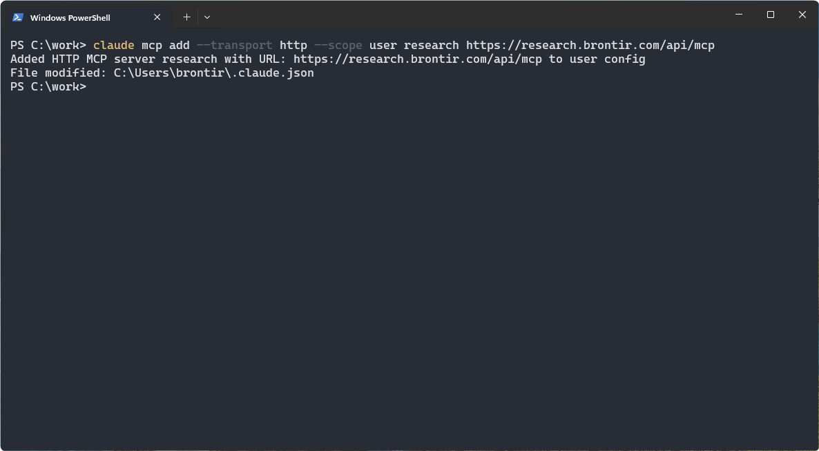 A terminal with the claude mcp add command and its confirmation